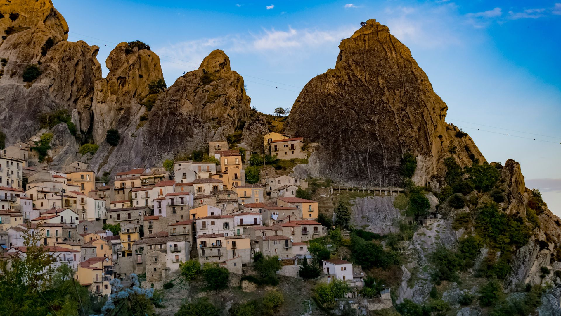 Image shows houses and Dolomite as backdrop of Potenza, Basilicata, Italy. 