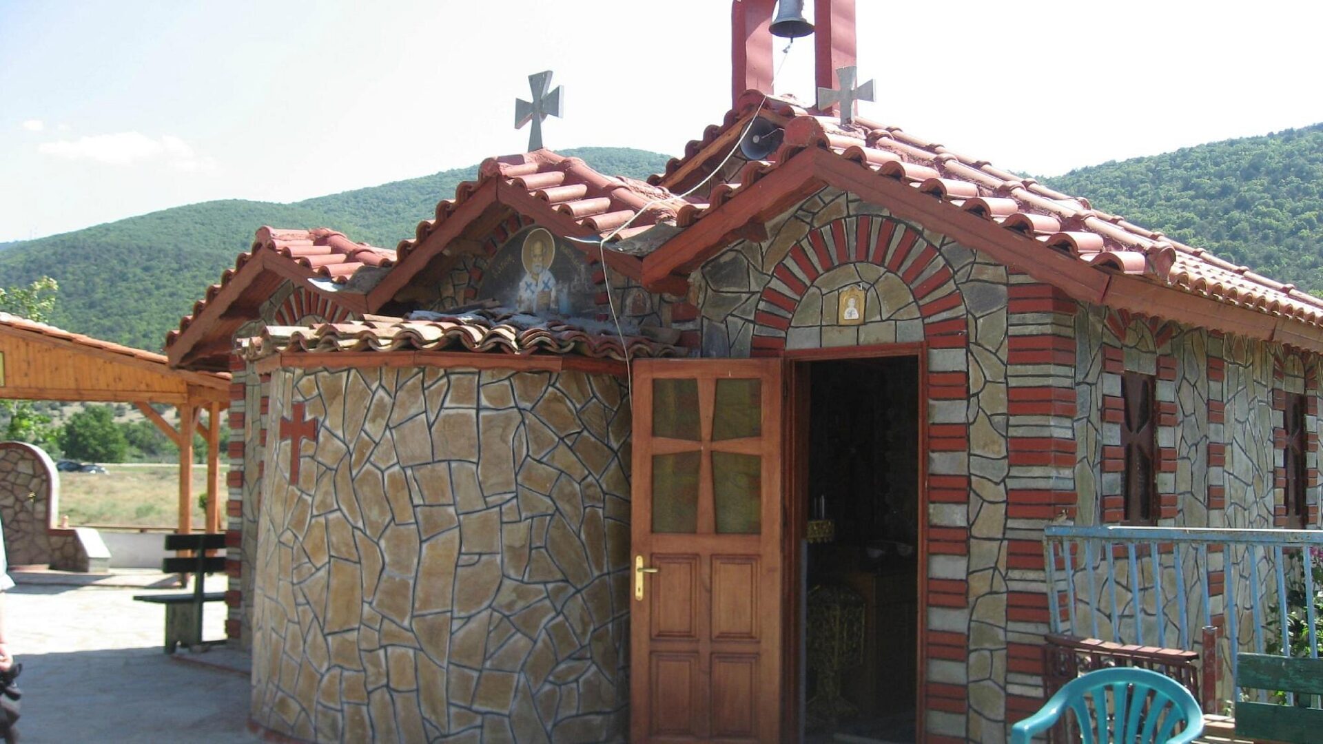 Exterior view of the Prespa Orthodox Cathedral with bell tower.