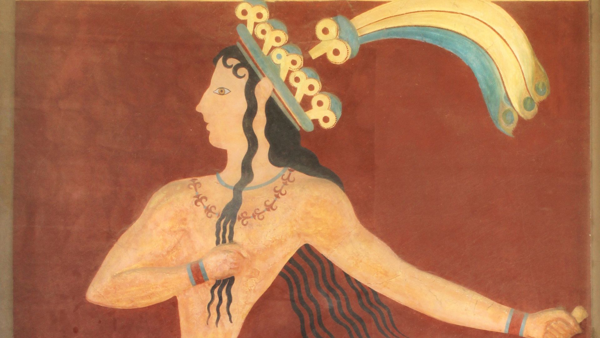 The Prince of the Lilies fresco, a Minoan painting depicting a man with a lily crown, displayed in the Heraklion Archaeological Museum.