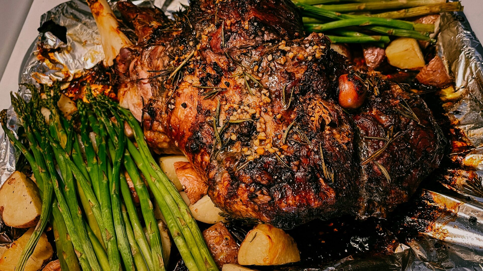 Roasted Lamb Leg, Potatoes, Asparagus, and Olive Oil.