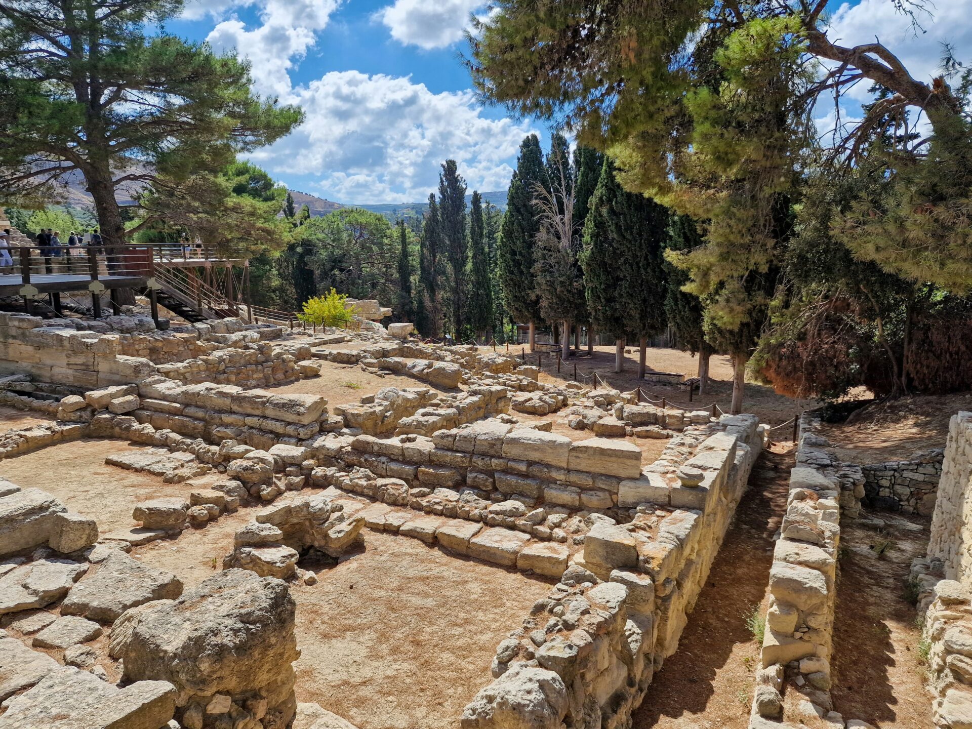 Stone ruins of Knossos Palace with scattered ancient walls