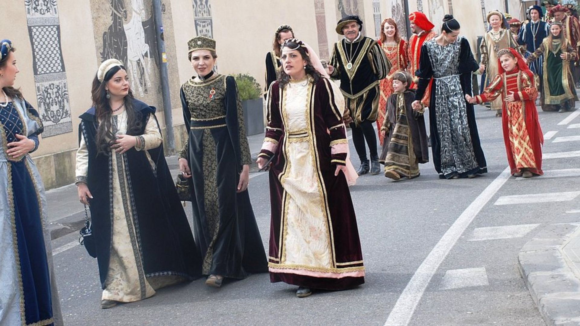 Image shows some Festival goers dress up walking on the streets. 