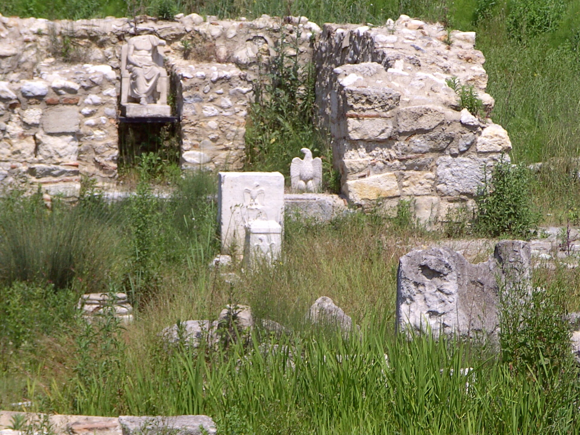 Ruins of the Sanctuary of Zeus at Dion with stone altars and columns.