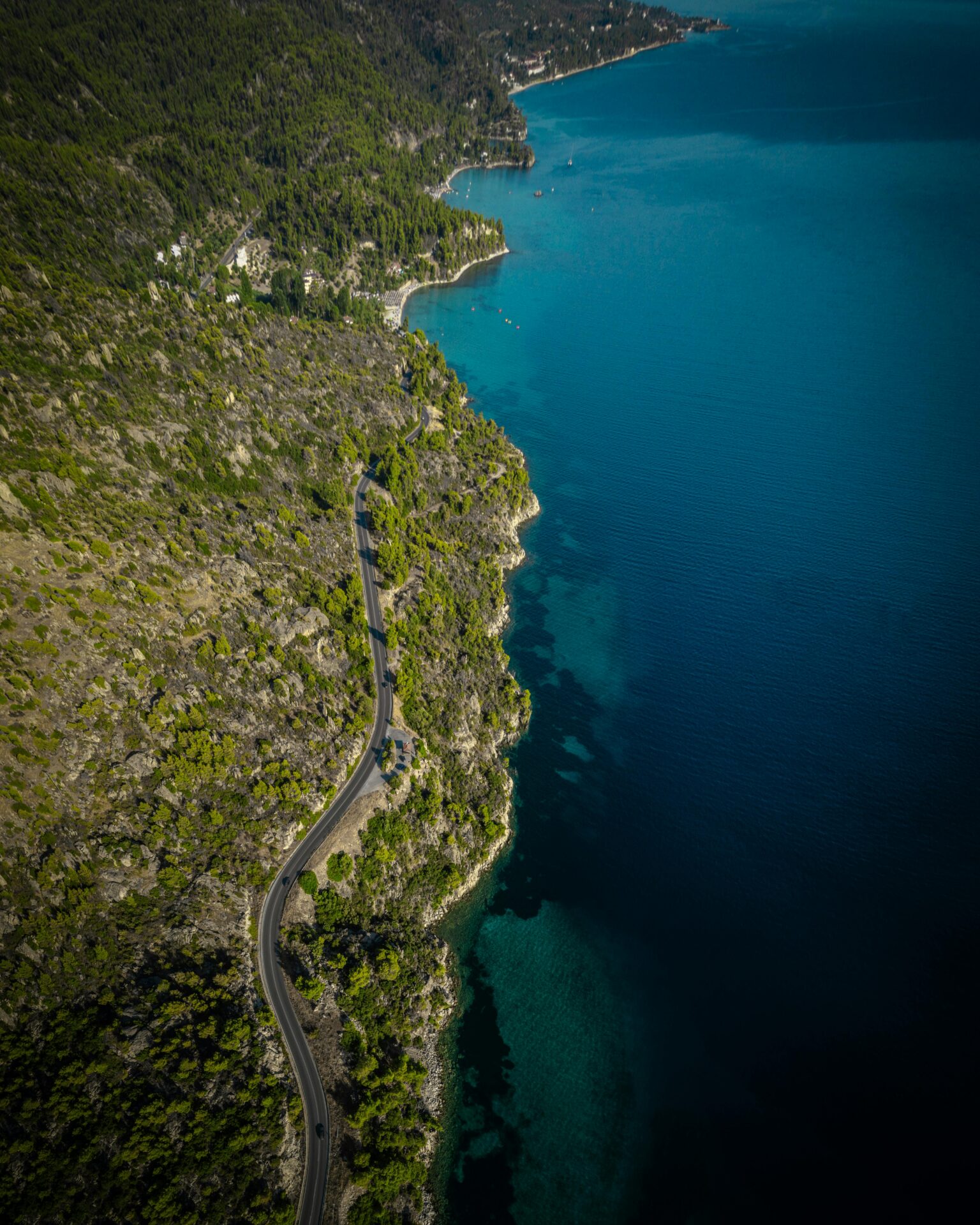 Aerial view of the winding coastal road along the Sithonia peninsula in Chalkidiki,