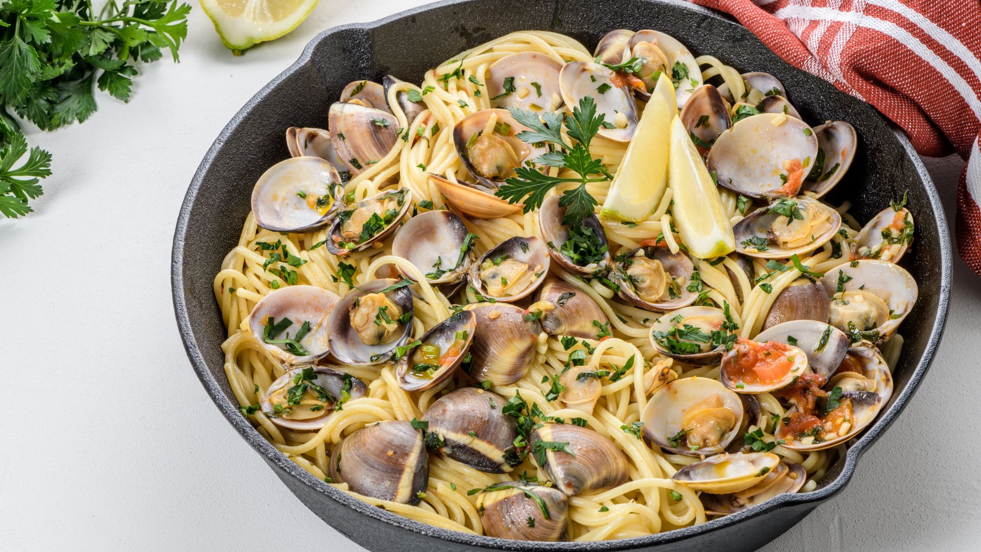 Image shows Spaghetti alle vongole (clam pasta) . 