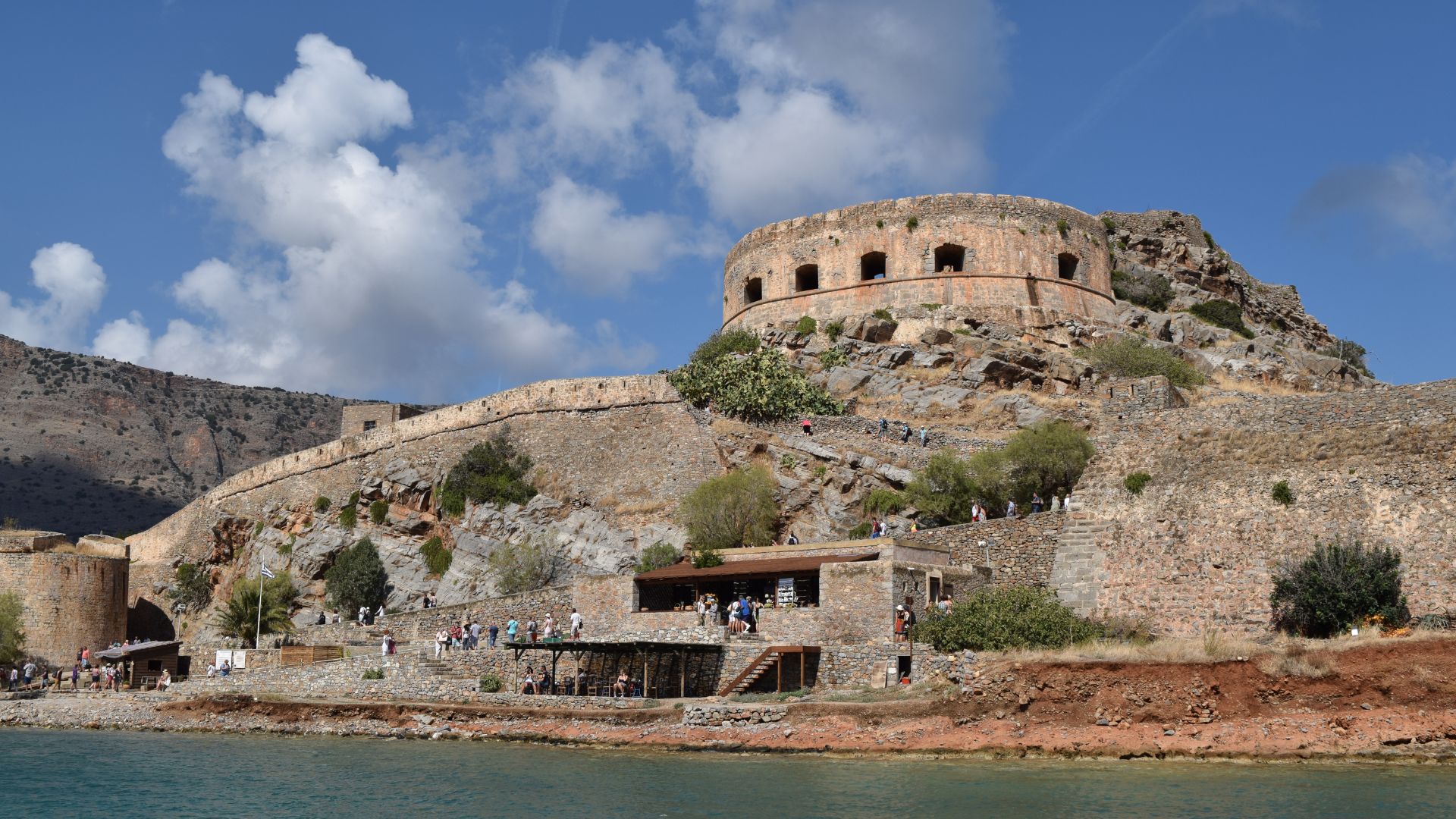 Closer look on Spinalonga Island, Crete, featuring the Venetian fortress ruins.