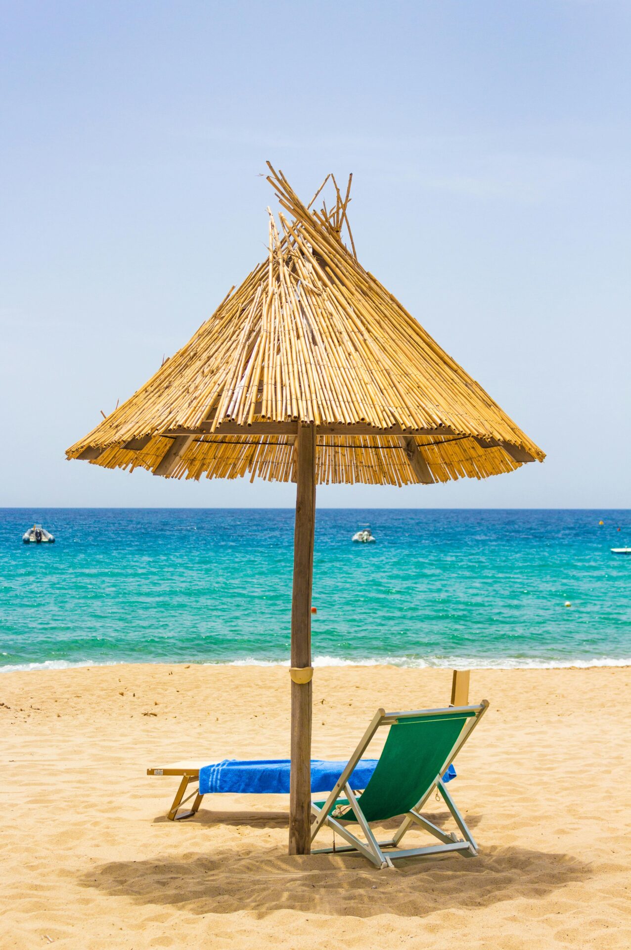 View of a stunning Sardinian beach with soft white sand and crystal-clear turquoise water