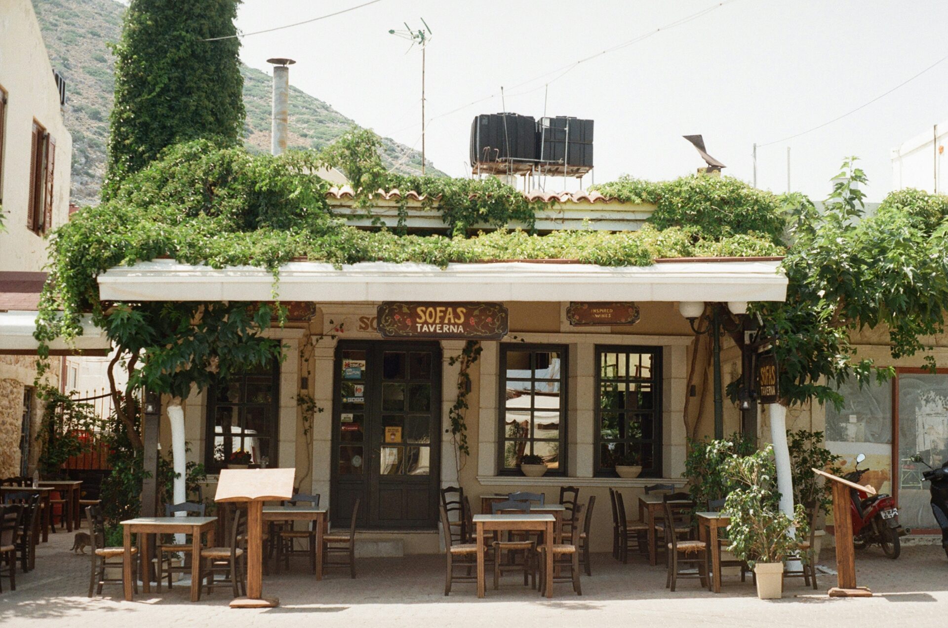 Traditional taverna in Crete with rustic decor and outdoor seating