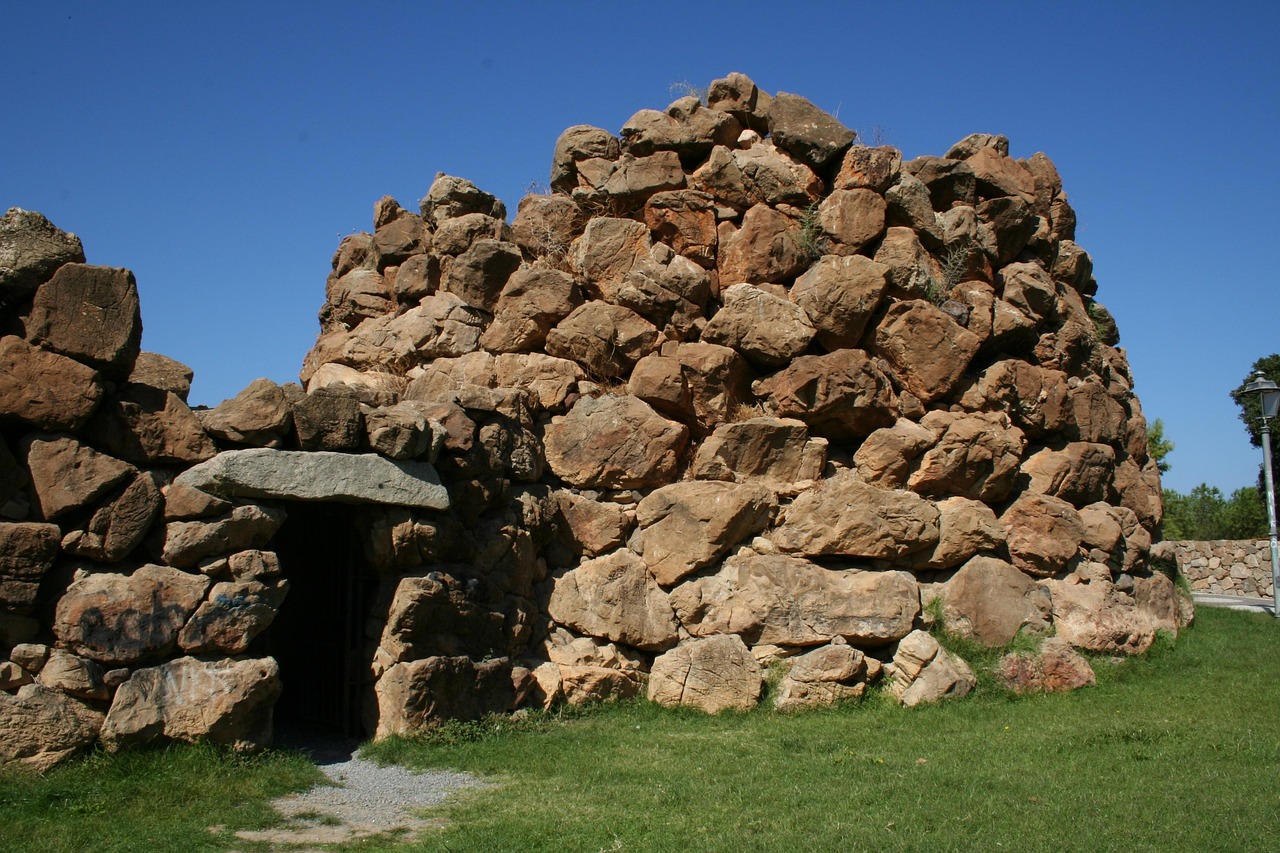 Close up image of a large, complex nuragic archaeological site in Sardinia, Italy.