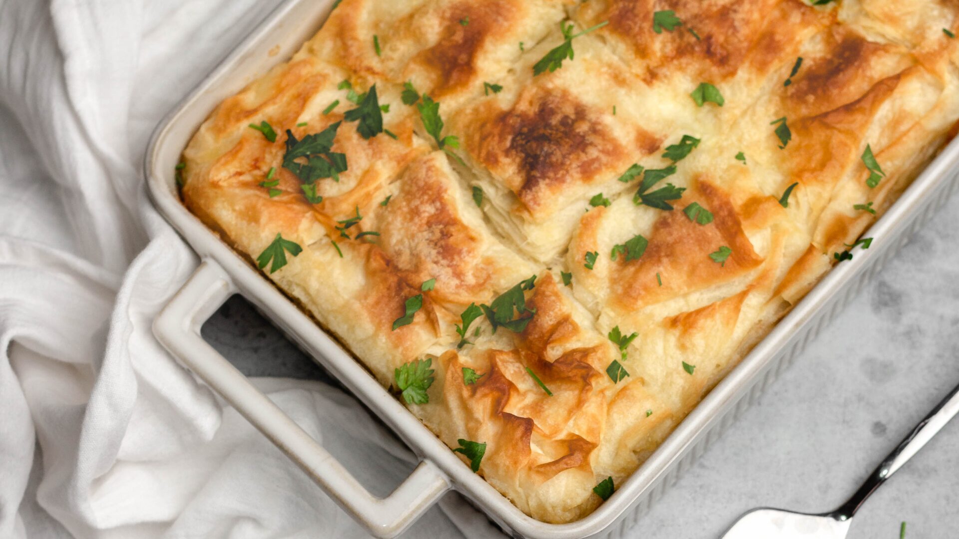 Spanakopita on a baking dish