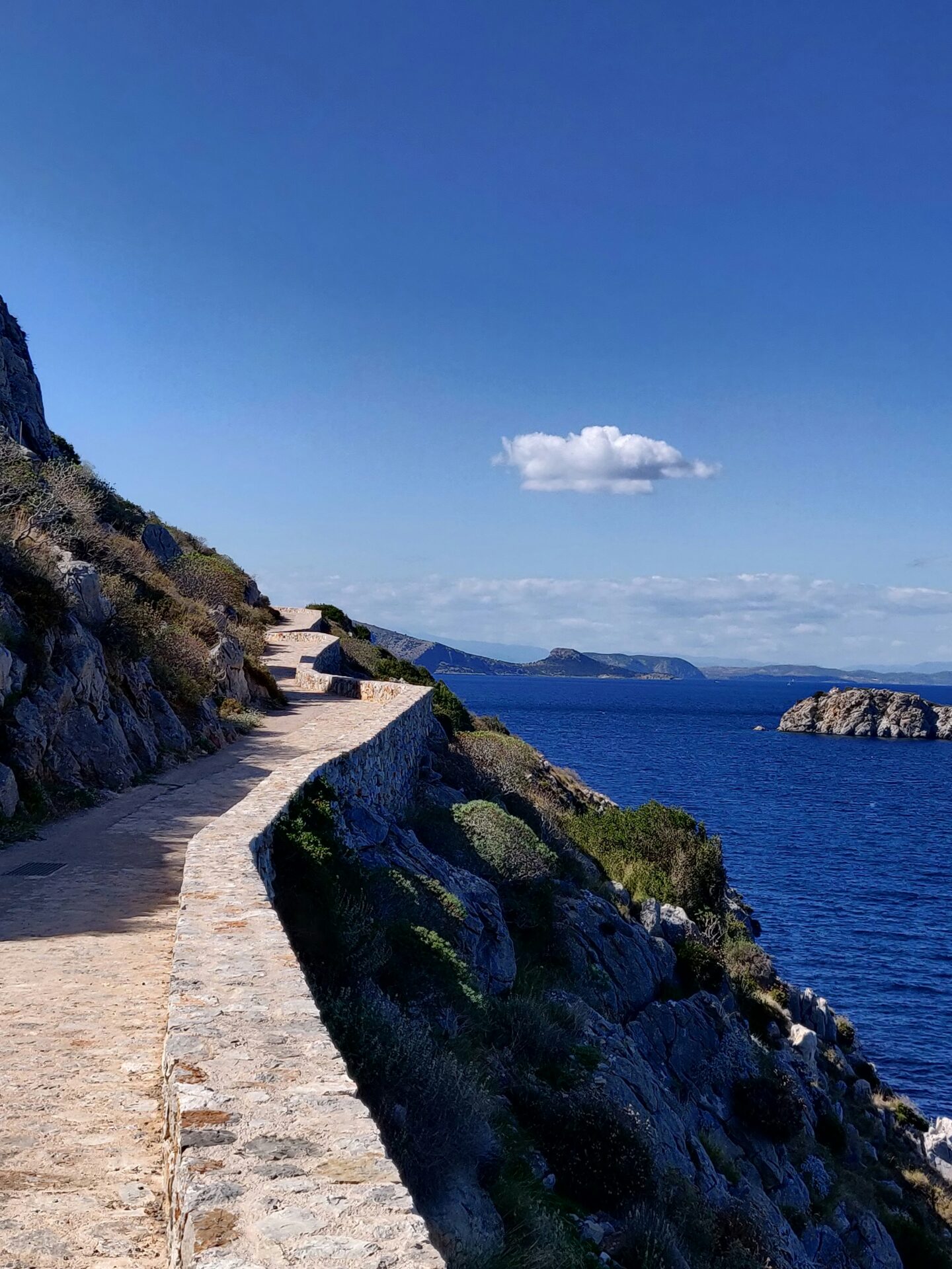 A path at the cliff - coastal view in Hydra, Greece