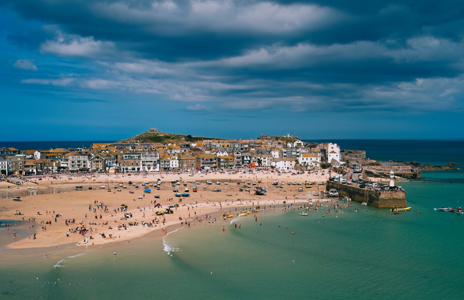 Scenic view of St Ives, with its golden beach and bustling harbor
