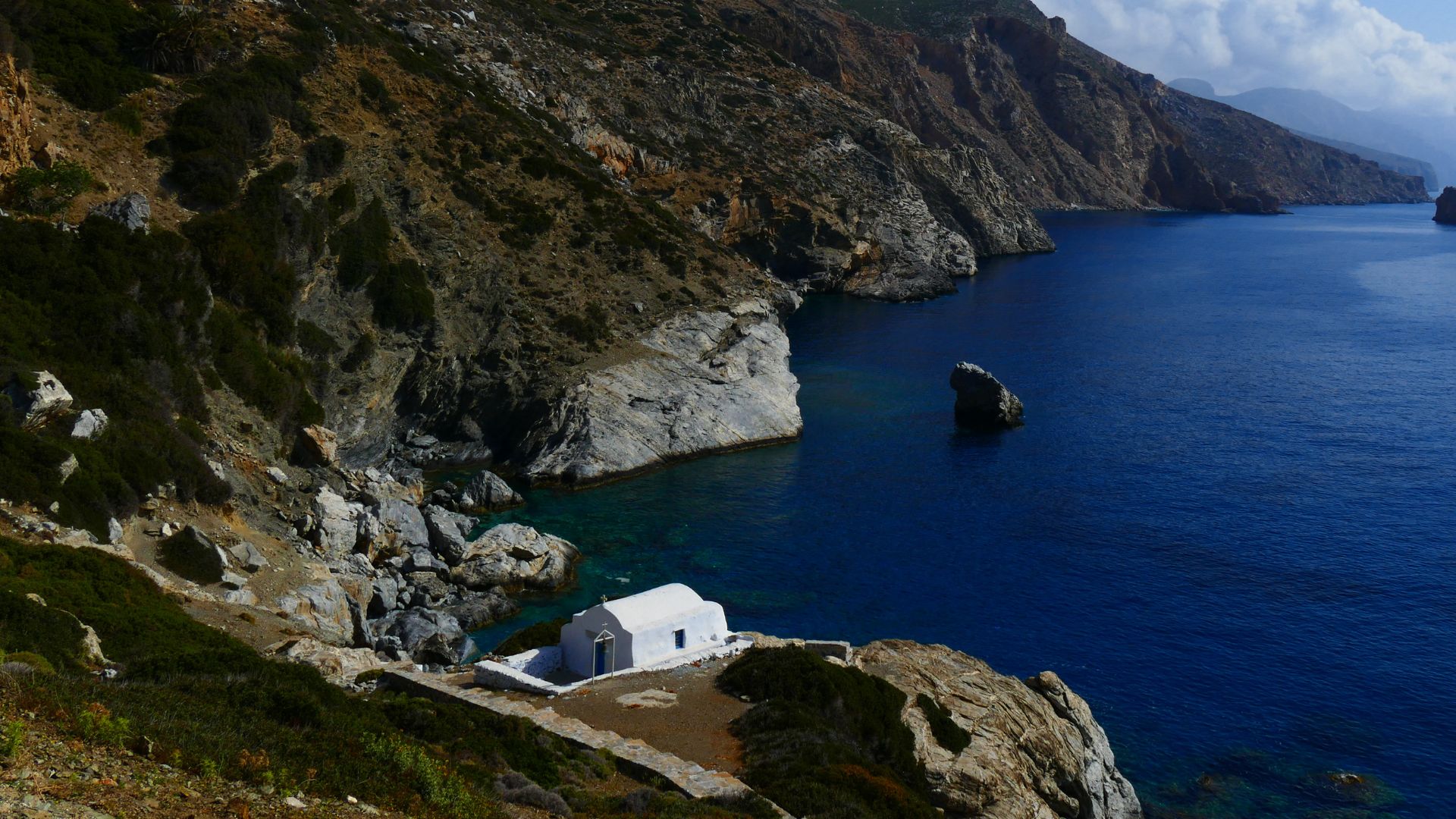 Agia Anna cove with a small white chapel in Amorgos, Greece.