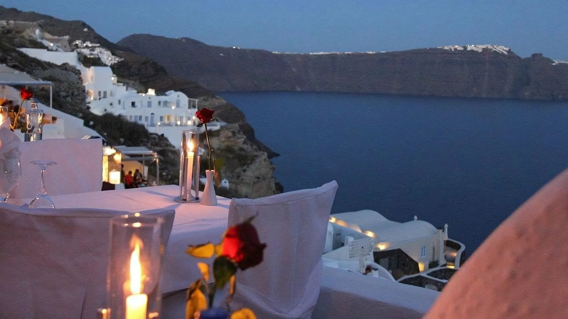 Scenic view of Ambrosia Restaurant in Oia, Santorini, Greece overlooking the sea.