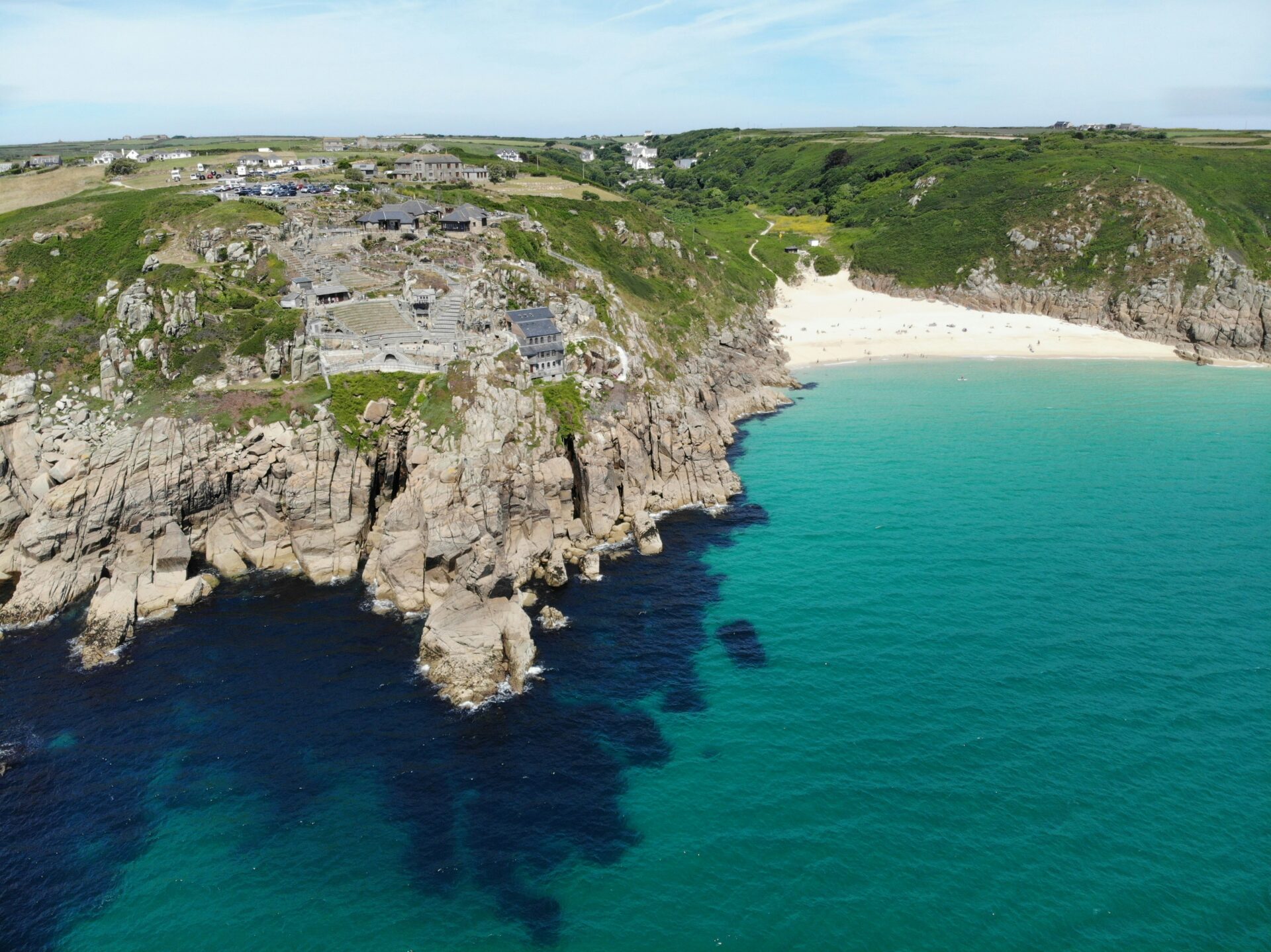 A high-angle view of the Minack Theatre and surrounding coastline