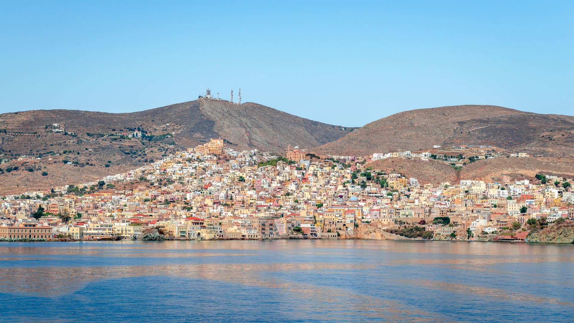 Panoramic view of Ano Syros, Greece, a charming hilltop town with traditional Cycladic architecture.