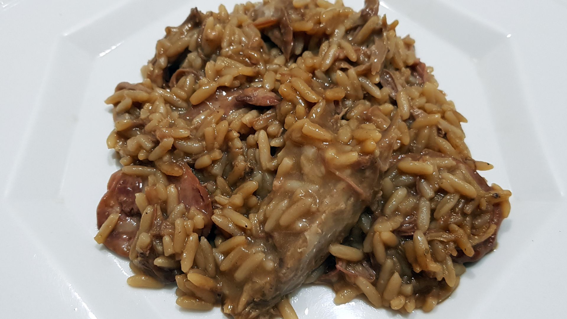 Arroz de Sarrabulho on a plate.
