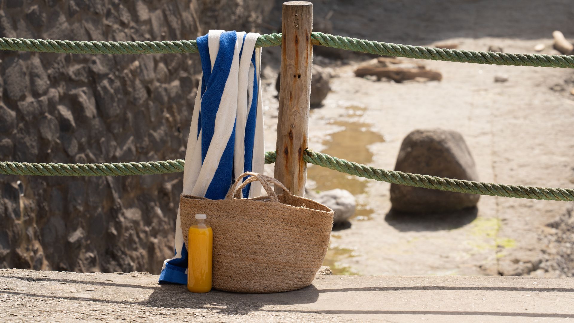A towel, bag, and a water bottle. 
