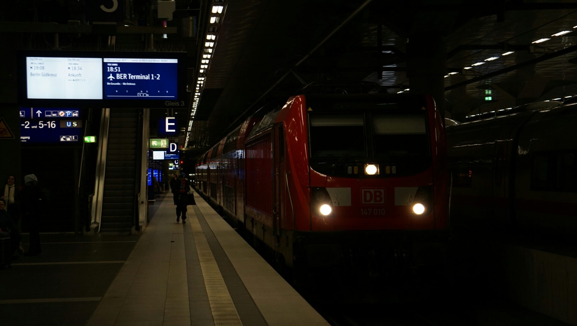 Berlin train platform with passengers waiting beside train