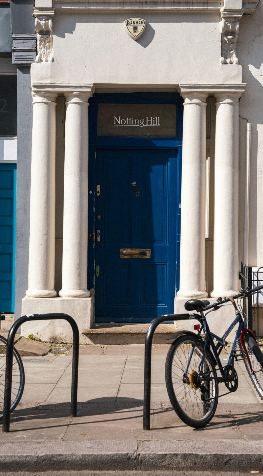 Bright blue front door of a classic Notting Hill house