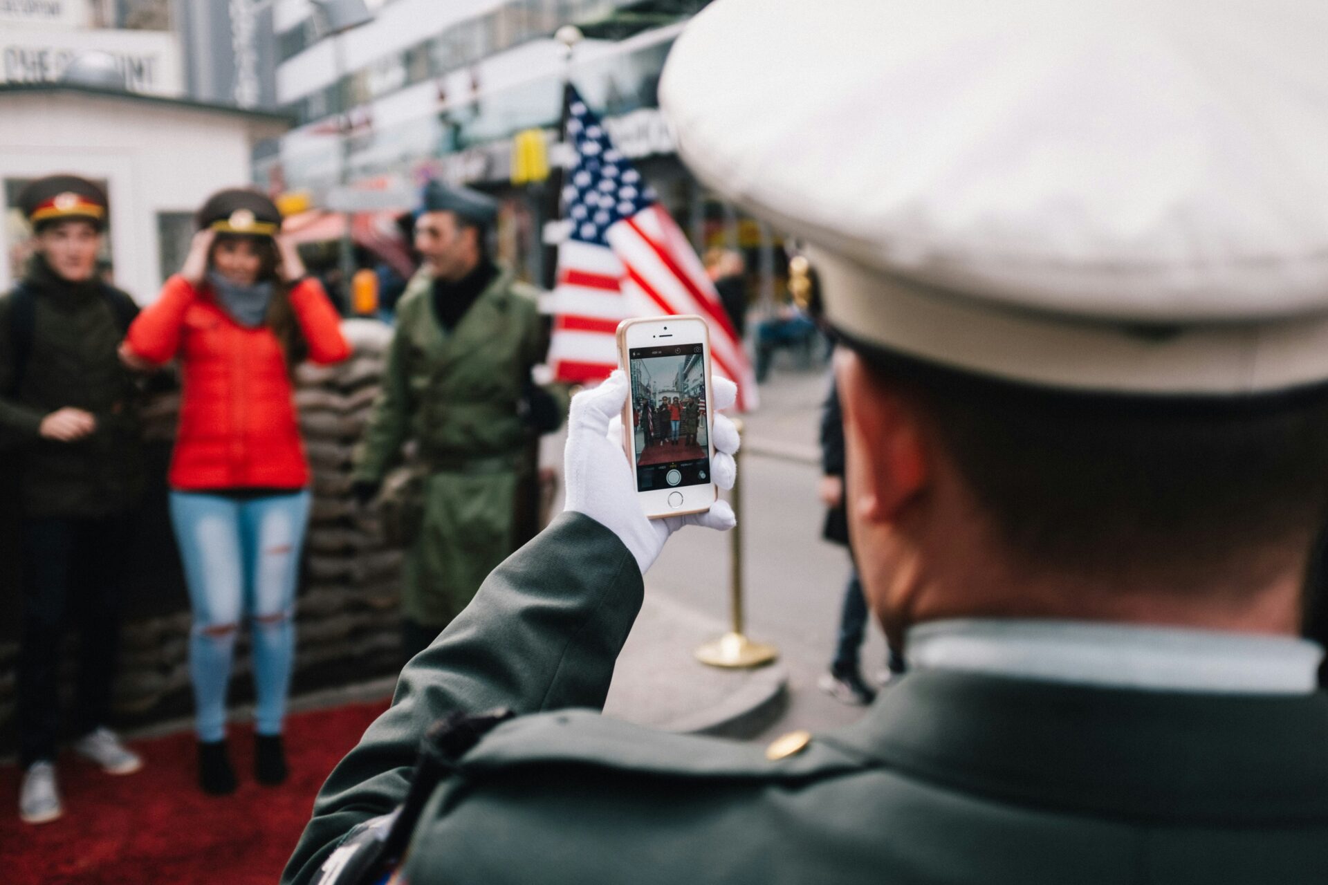 Tourists taking photos at former US Army checkpoint in Berlin