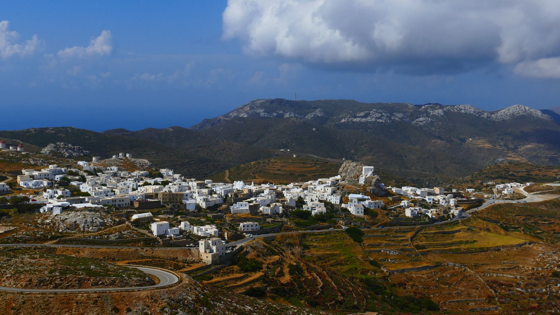 A hillside village of whitewashed houses in Amorgos, Greece.