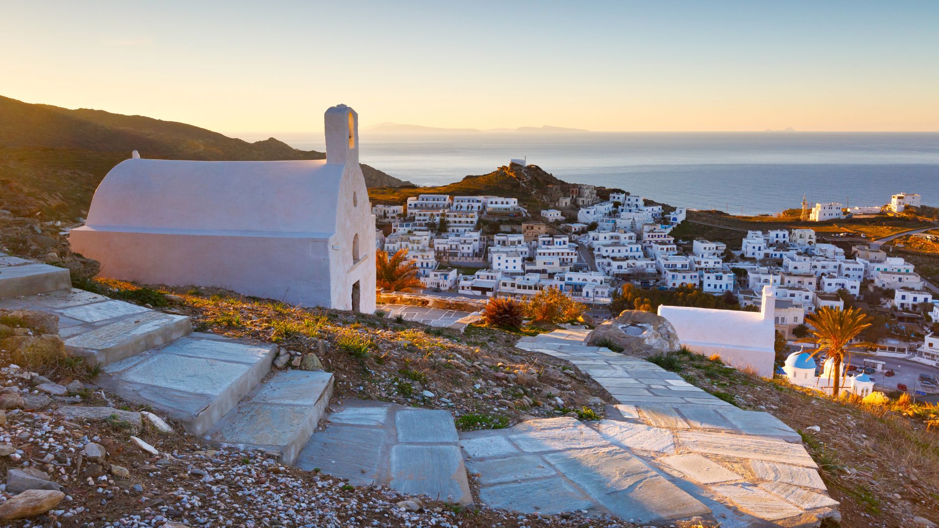 Chora village, Ios Island, Greece, with steps leading to a church.