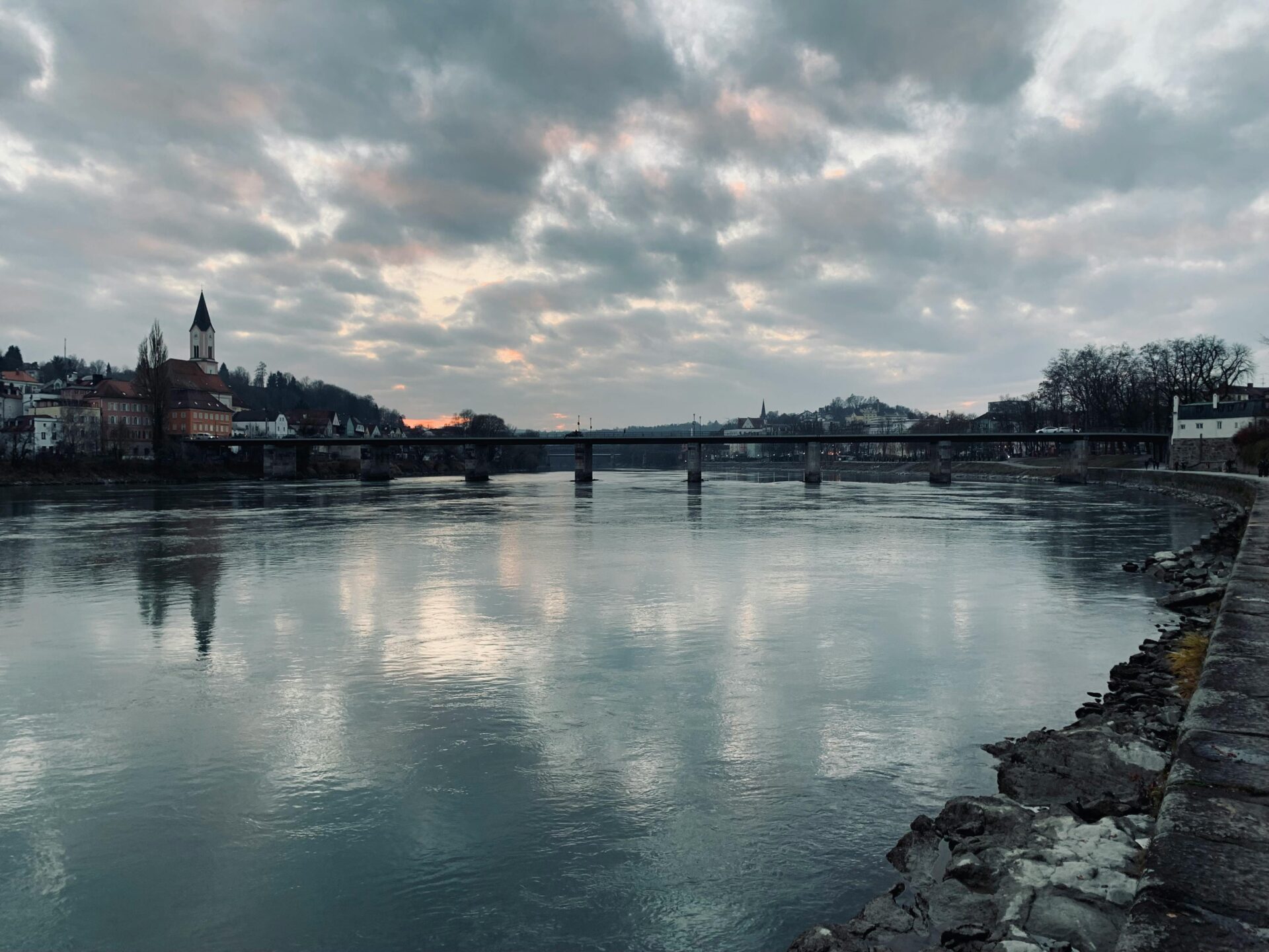 Cloudy Sky Over a Bridge Stretching over a River in Passau