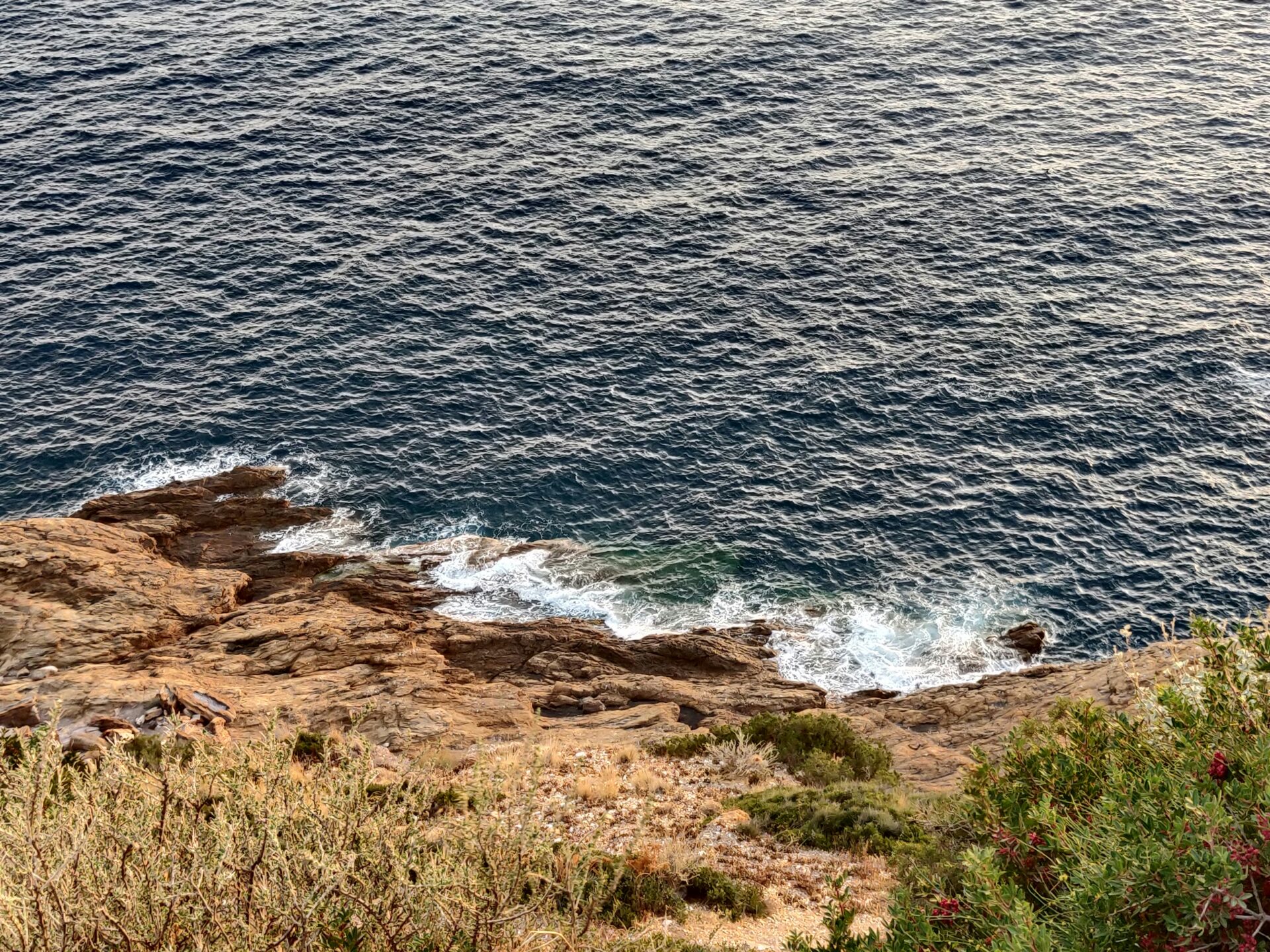 Coastal cliff with waters - Sounion, Greece