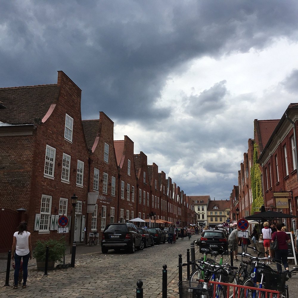 Historic gabled facades and white-trimmed windows lining the Dutch Quarter in Potsdam.