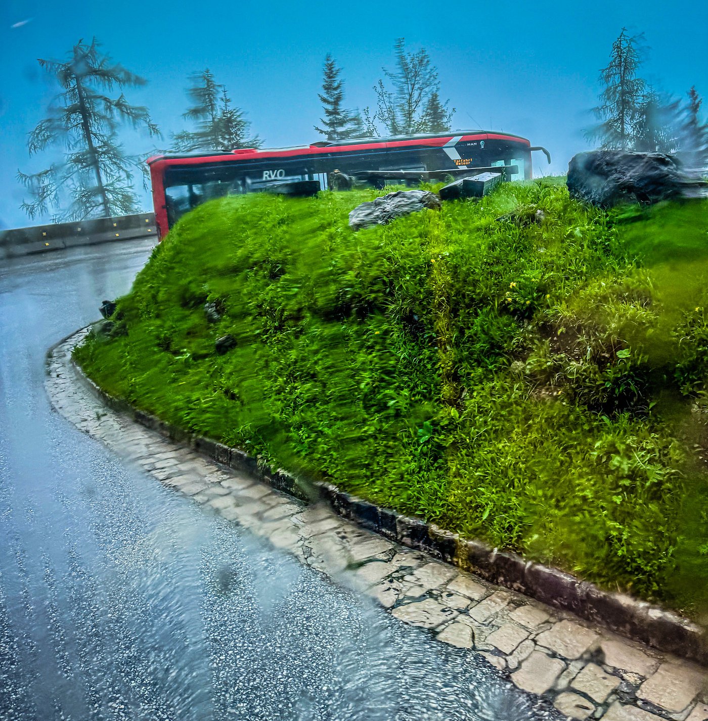 Eagle’s Nest bus driving along a narrow, winding mountain road