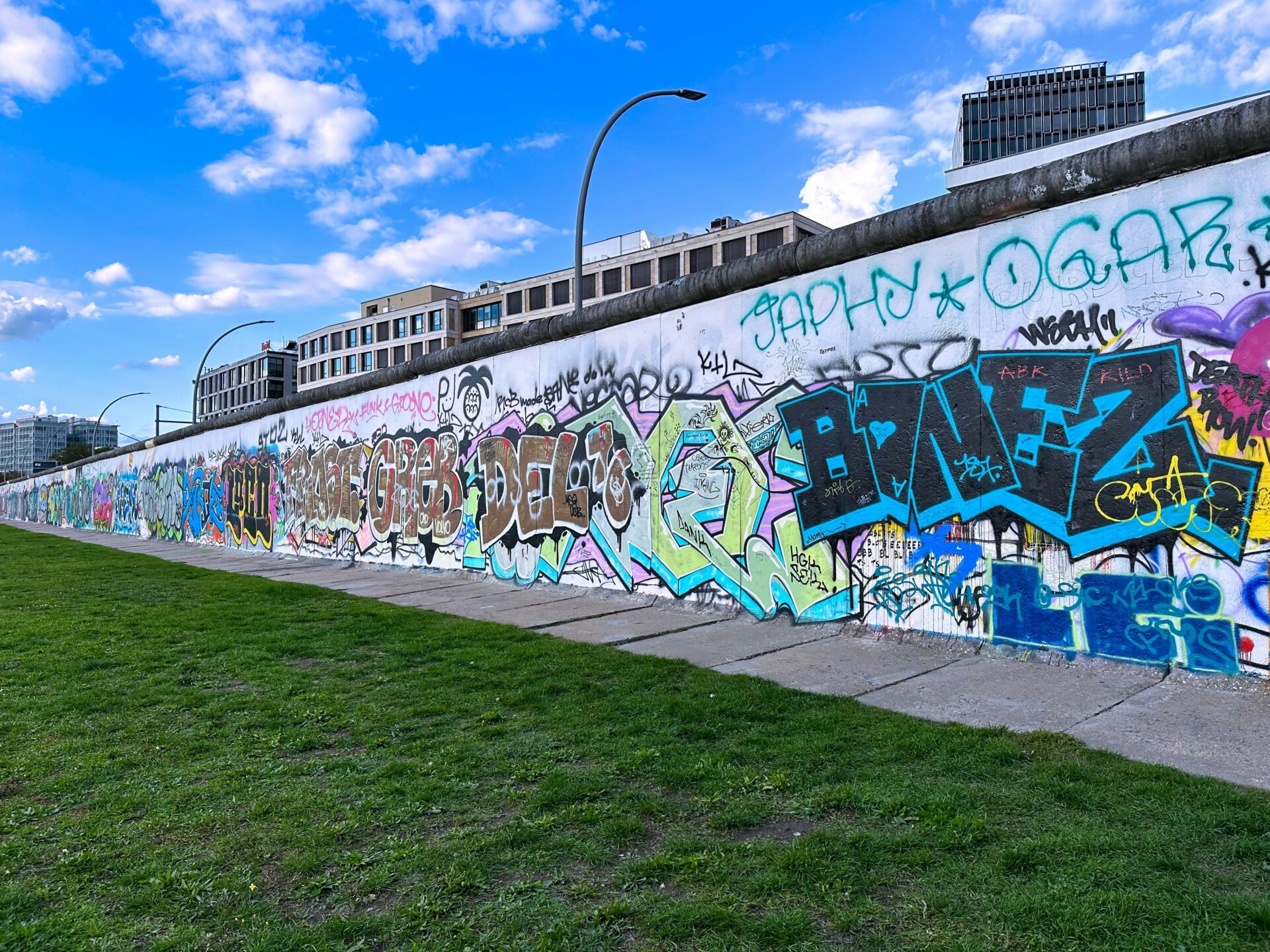 Street art on preserved Berlin Wall section, East Side Gallery.