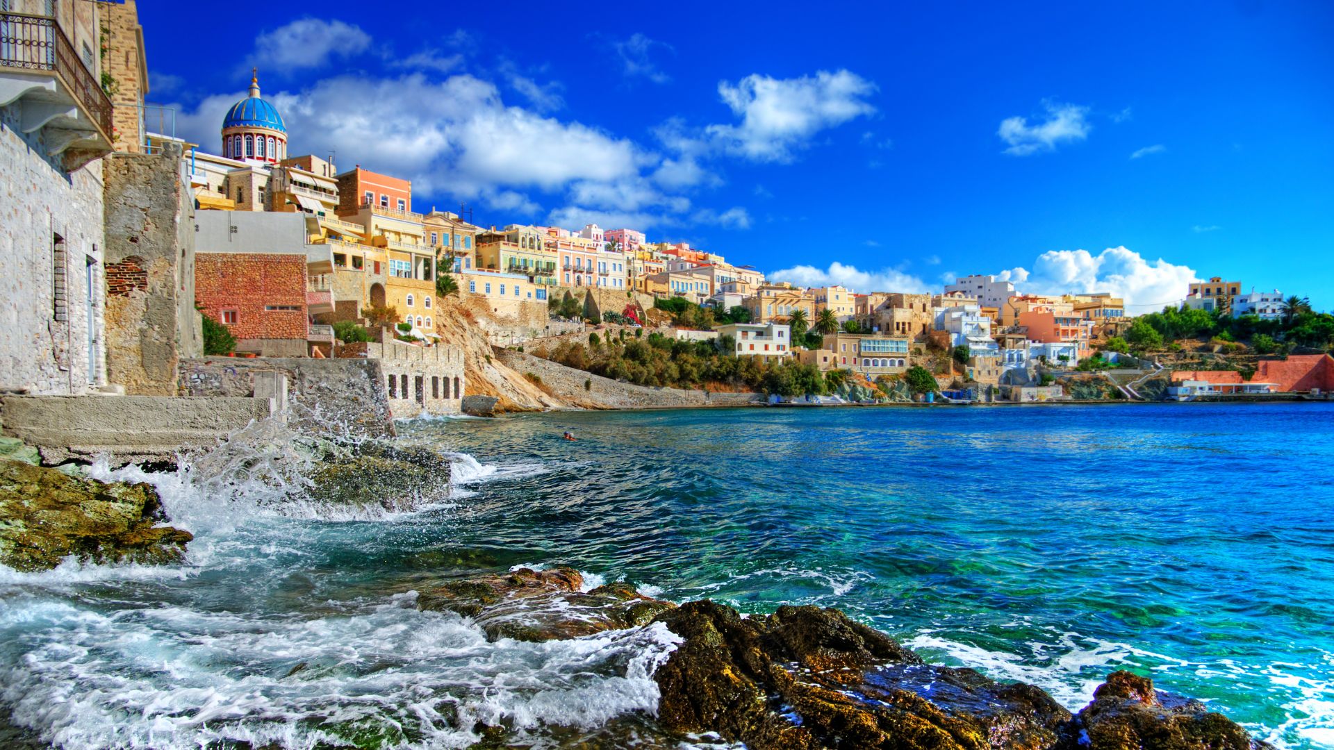 Coastal view of Ermoupoli, Syros, Greece, showcasing its unique architecture and seaside location.