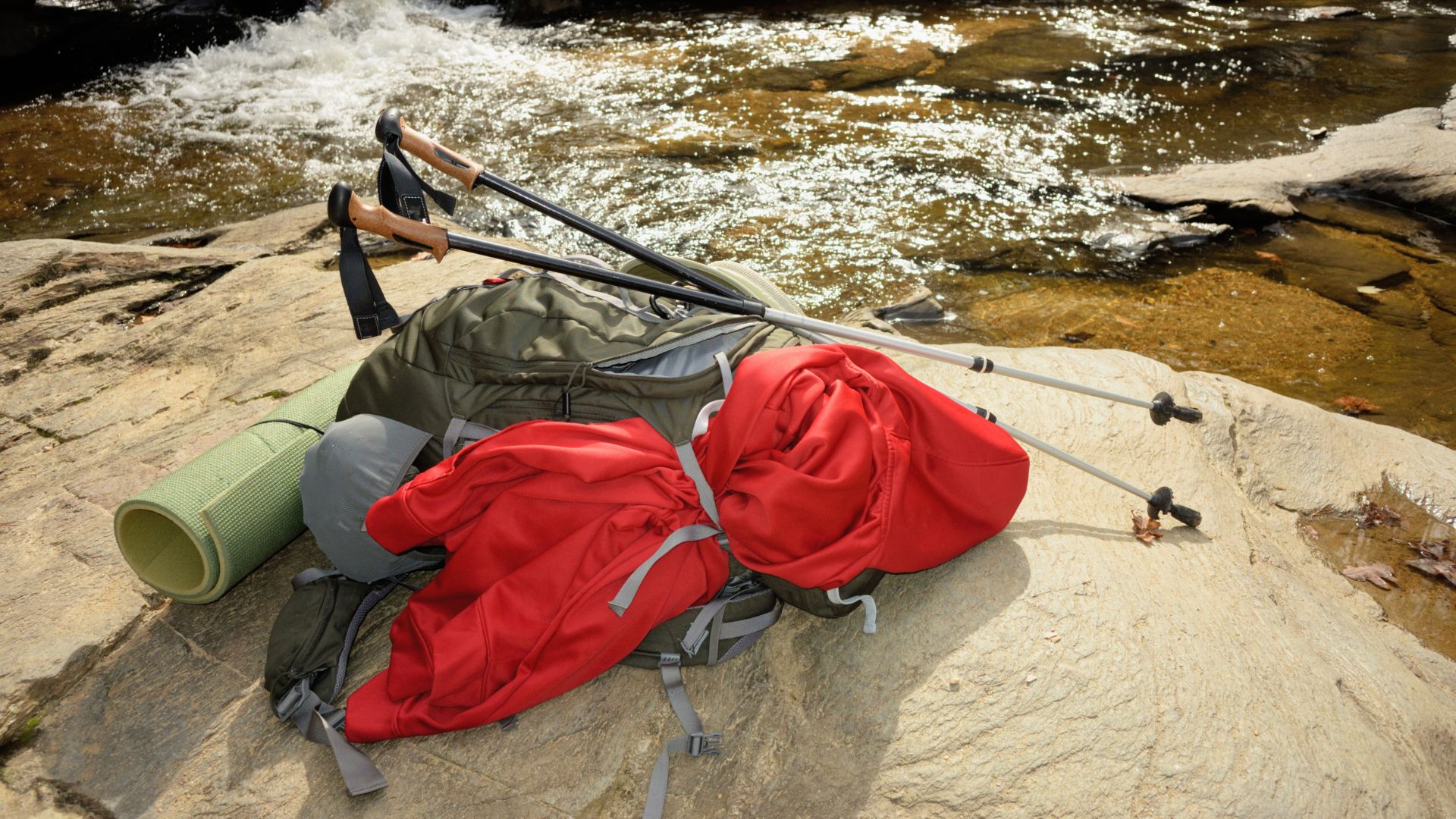 Essential hiking to waterfall gear: Backpack, waterproof jacket.
