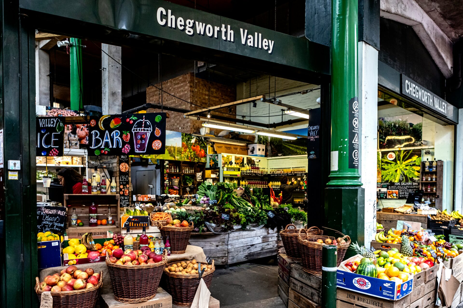 Stall selling locally grown root vegetables at Borough Market.