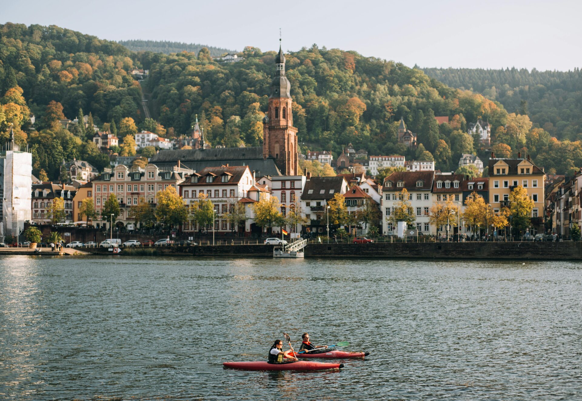 Heidelberg’s old town, lined with colorful historic buildings, with the Neckar River visible nearby