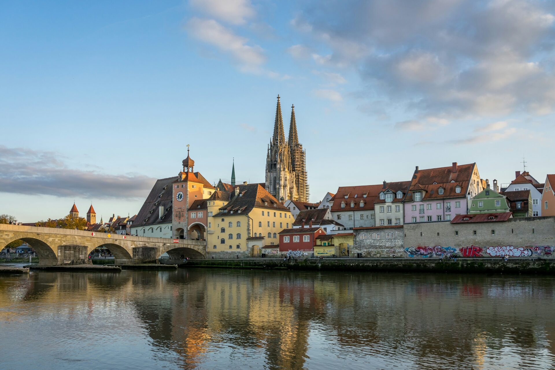 Historic stone bridge crossing the Danube River in Regensburg