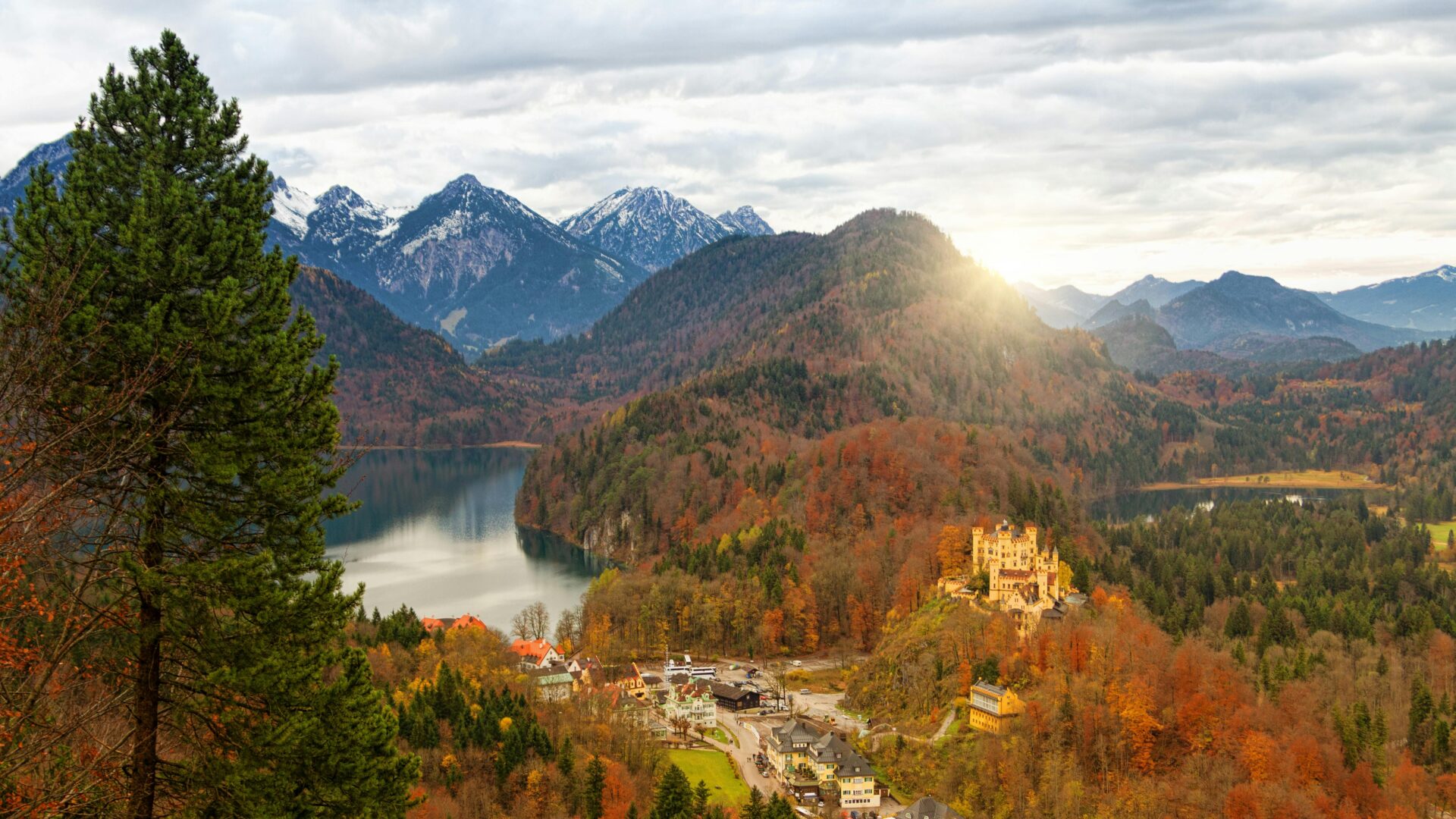 Hohenschwangau Castle framed by the golden and orange leaves of autumn