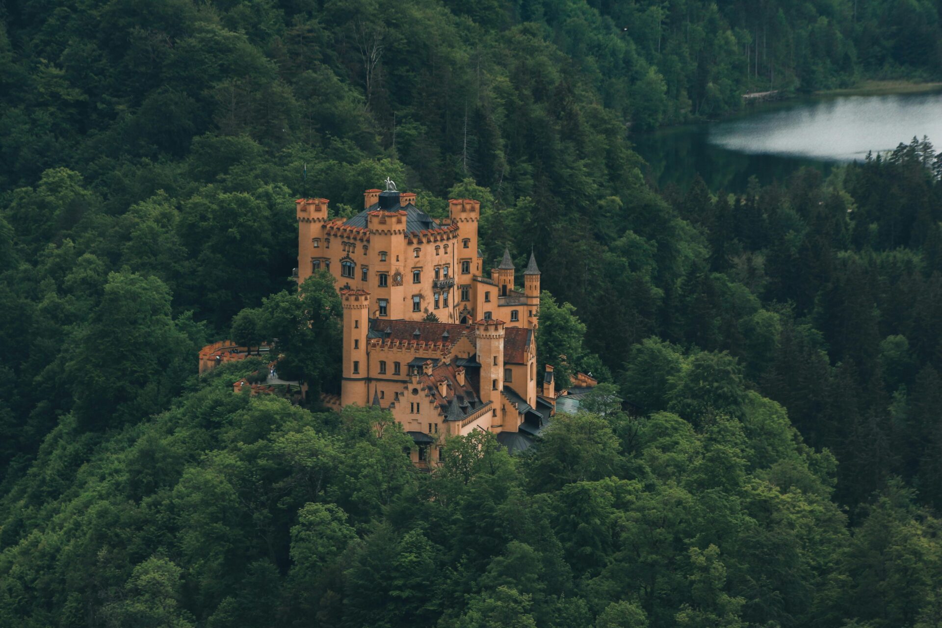 The picturesque Hohenschwangau Castle set amidst the green rolling hills