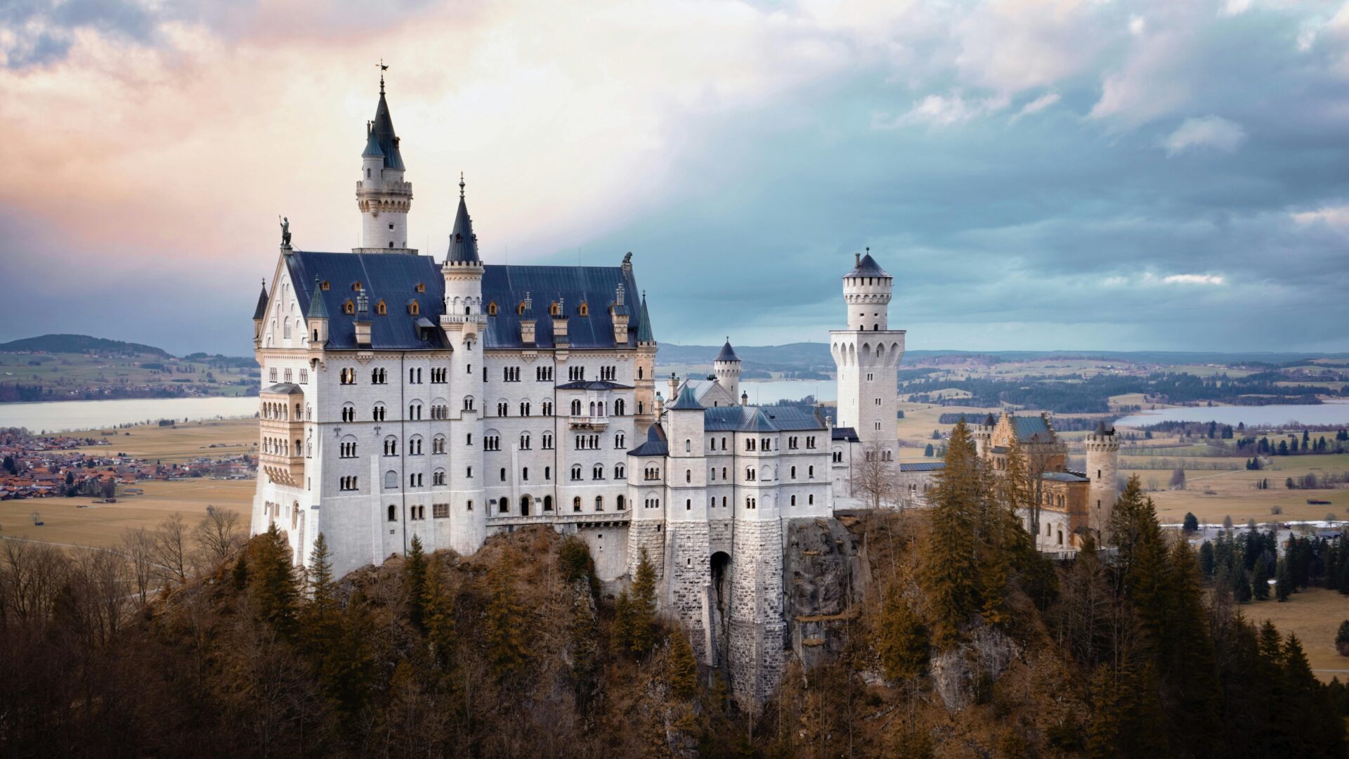 Hohes Schloss Füssen perched above the old town with its distinctive red-roofed towers and painted facade