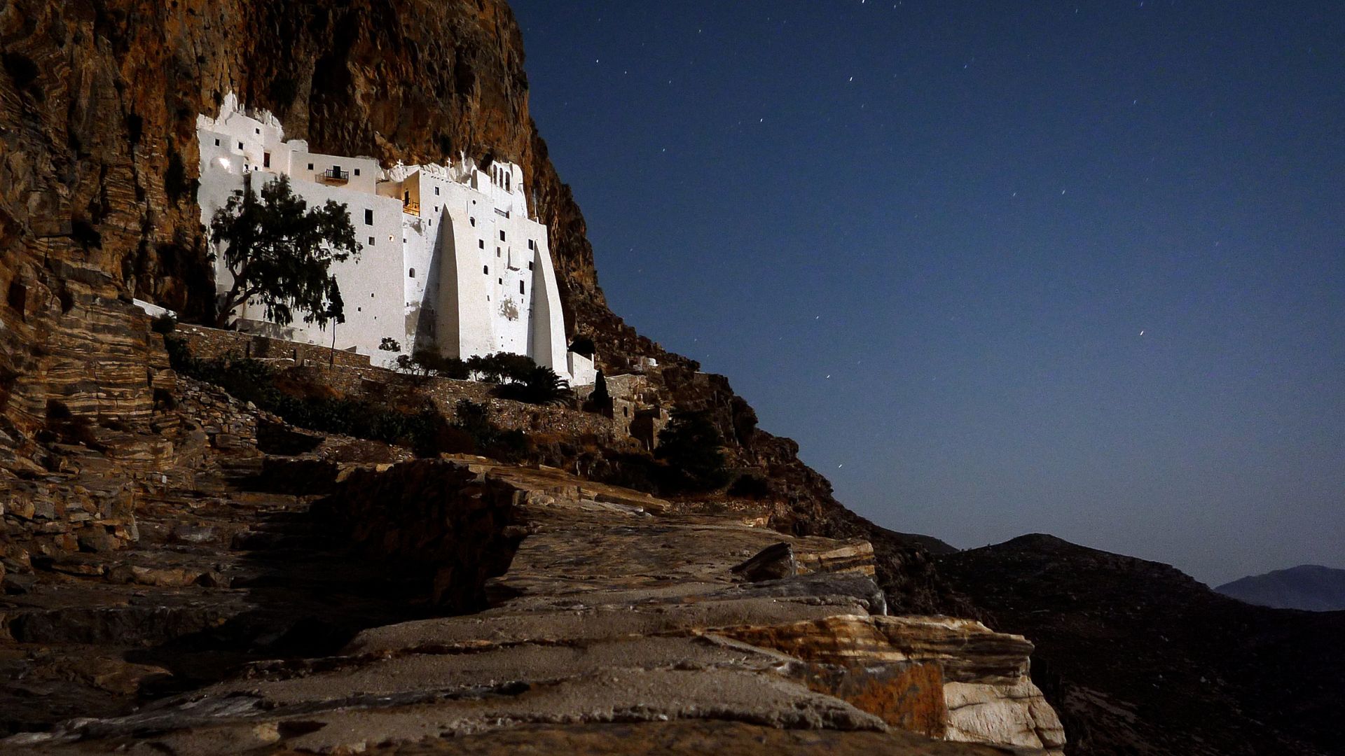 Panagia Hozoviotissa Monastery built into a cliffside in Amorgos, Greece.