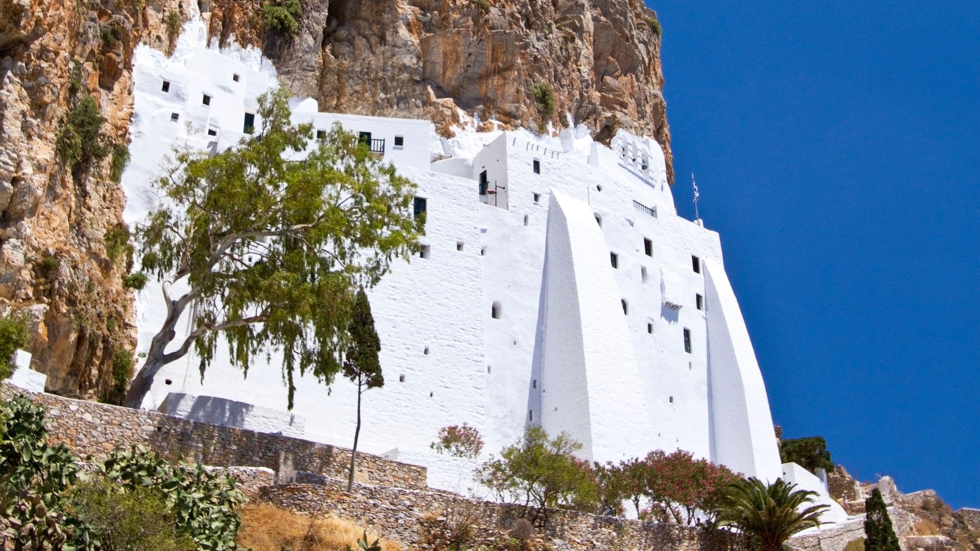 Panagia Hozoviotissa Monastery built into a cliffside in Amorgos, Greece.
