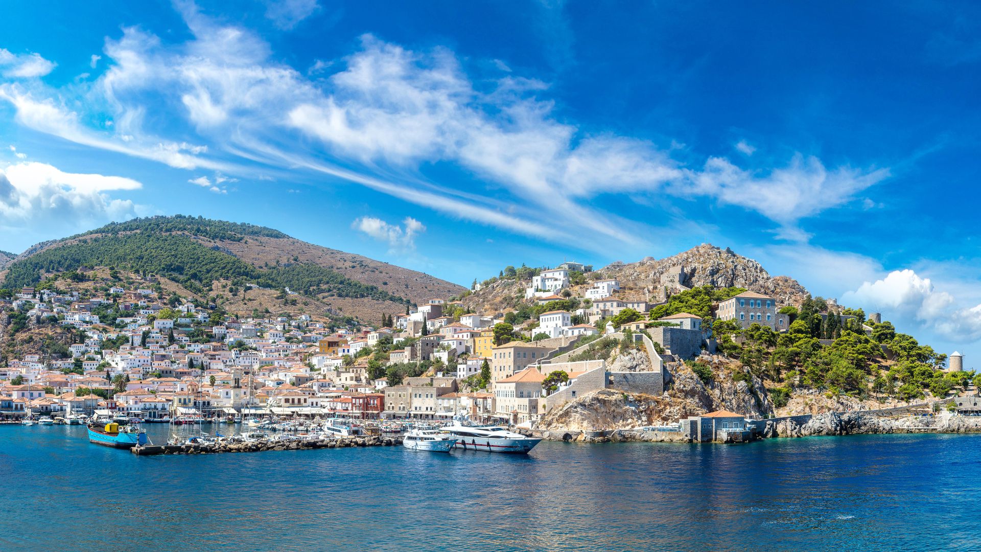 Hydra Island, Greece: Scenic view of the harbor and traditional architecture.