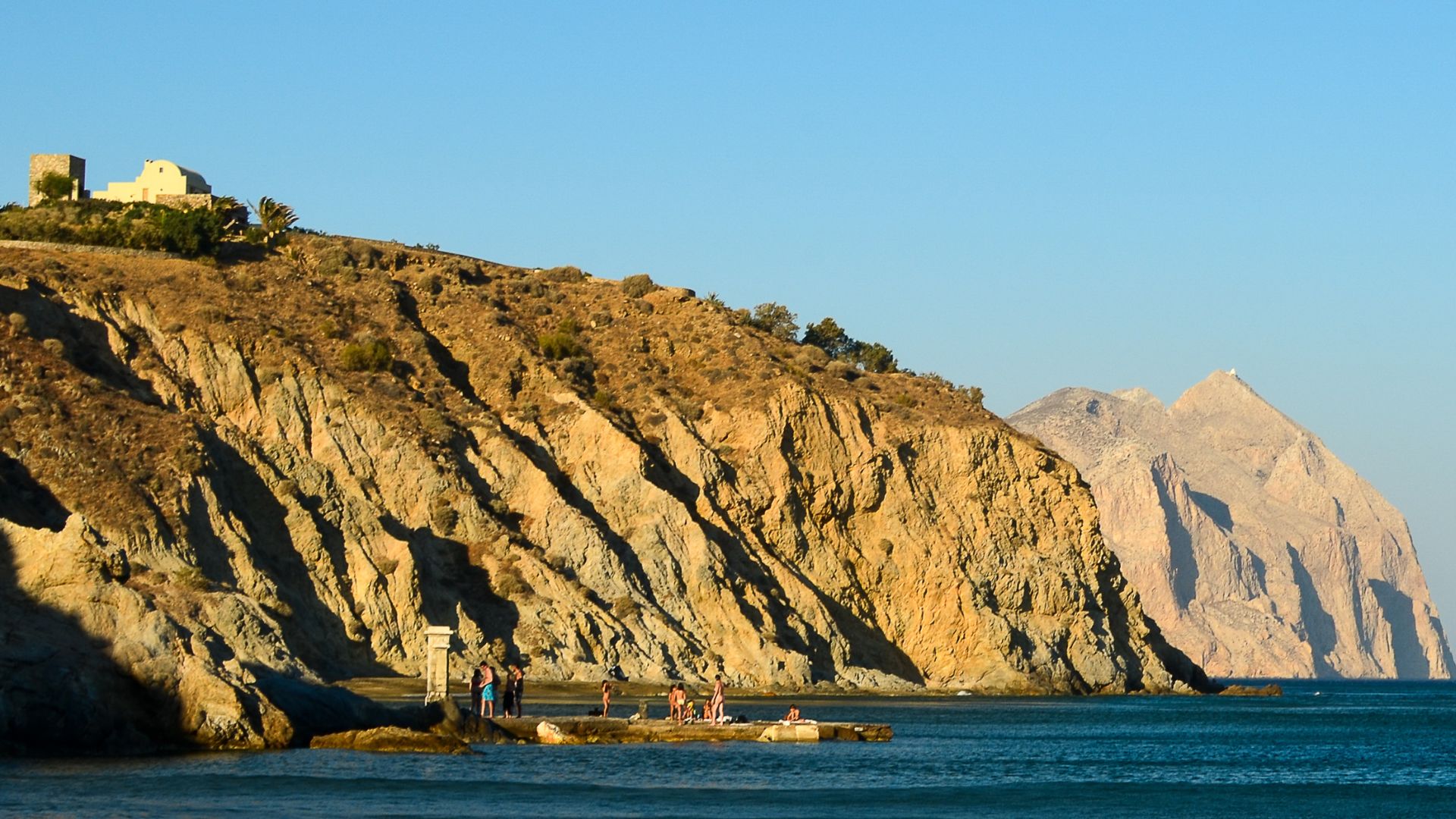 Panagia Kalamiotissa Monastery on Mount Kalamos with Aegean Sea and coastline.