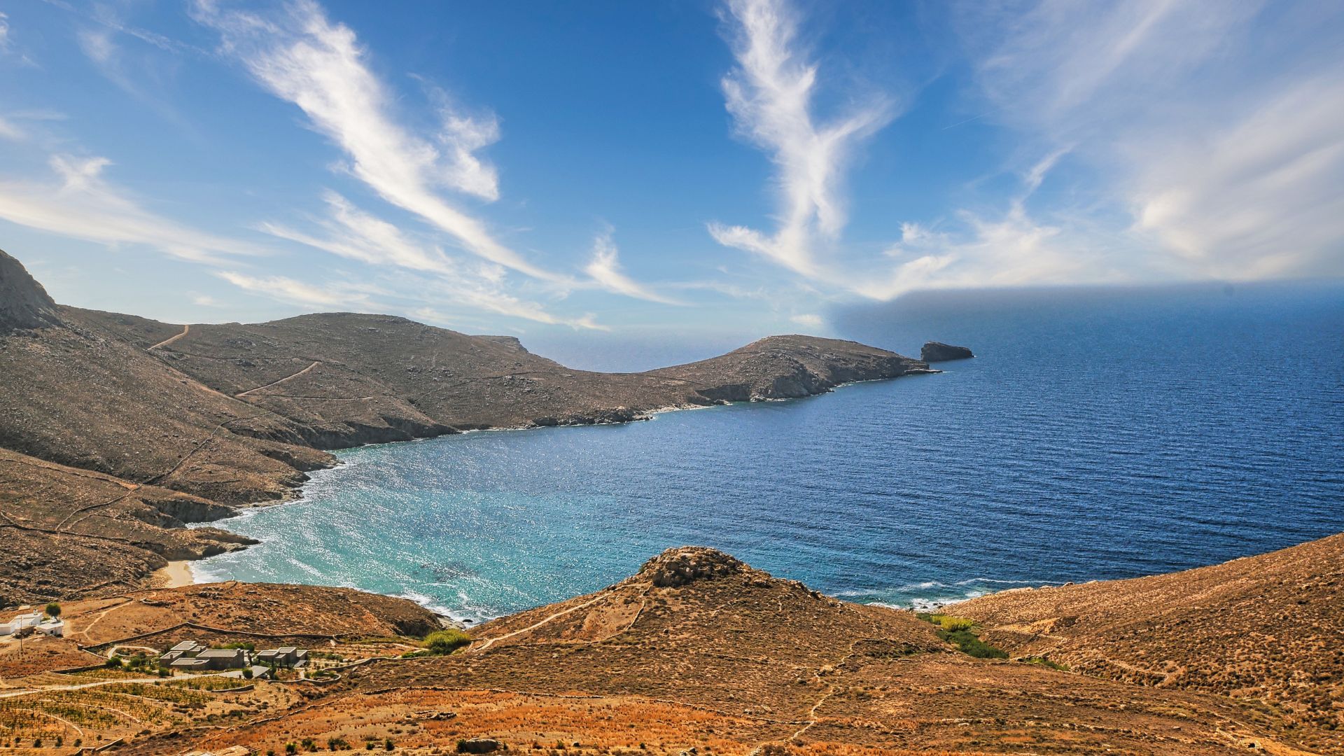 Scenic view of Kalo Ampeli beach, Serifos, Greece, with its turquoise waters and surrounding hills.