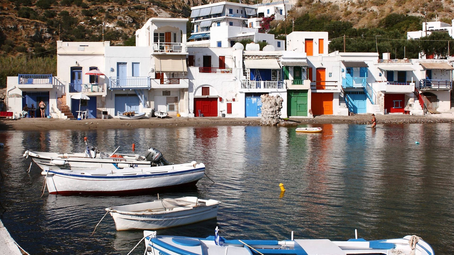 Mandrakia fishing village in Milos, Greece, with colorful boat houses.