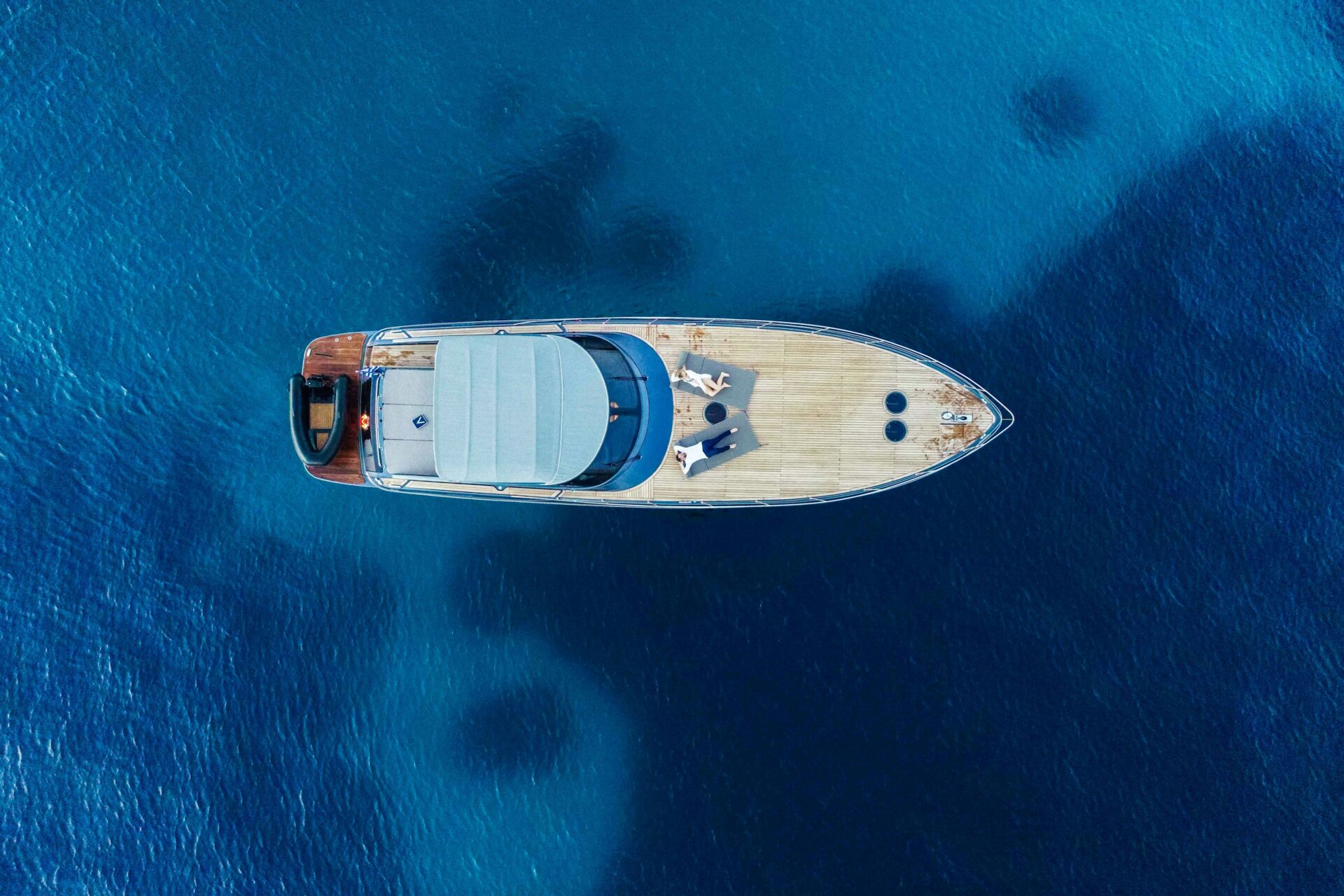 Lake Vouliagmeni, Vouliagmeni, Greece - blue waters with a small boat
