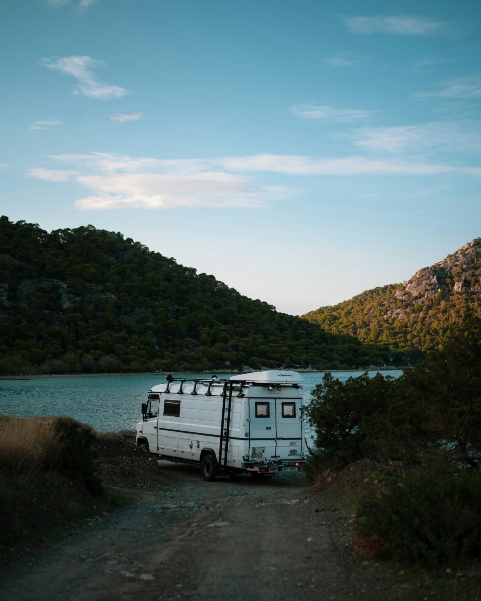 Lake Vouliagmeni, Vouliagmeni, Greece - campervan parked near the lake