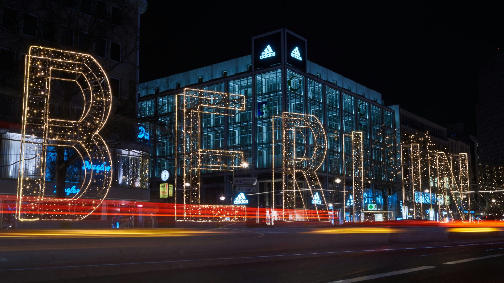Lighted Berlin sign at night