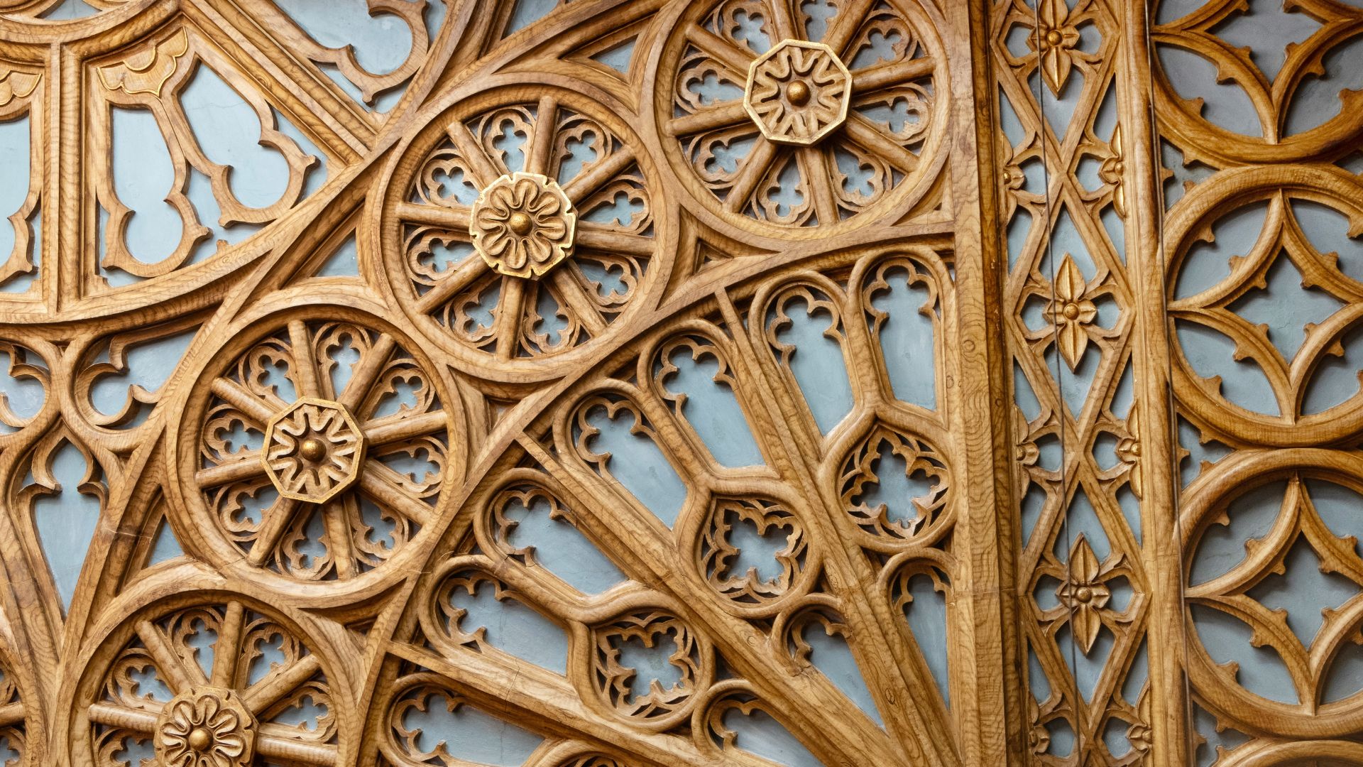 A close-up shot of ornate wooden carvings inside Livraria Lello.